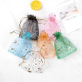 Hot Sale Wholesale in Stock Fashion Star Pattern Christmas Transparent Organza Drawstring Bag for Packing Candy