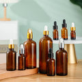 Wholesale 5ml 10ml 12ml 15ml Clear Glass Dropper Bottle PP Plastic Black Cap Custom Logo Essential Oil Skin Care Cream Packaging