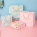 High Quantity Pink Elegant Boutique Wrapping Retail Shopping Packaging Luxury Jewelry Gift Paper Bag With Ribbon Handle