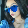 Wholesale Promotion Cheap Price Frameless Heart-shaped One-piece Candy Color Jelly Transparent Love Women Sunglasses