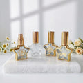 Portable 8ml Gold Stamping Glass Perfume Bottle Star Shaped Refillable with Fine Mist Sprayer Empty Glass Bottles