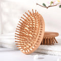 2026 New Arrival 100% Natural Oval Massage Travel Hair Brush with Paddle Vent Design Easy Carry Custom Logo Private Label Comb