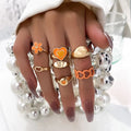 RisingMoon Fashion 7pcs/set Alloy Flower Heart Rings Gold Plated Ring Orange Enamel Ring Set for Girl