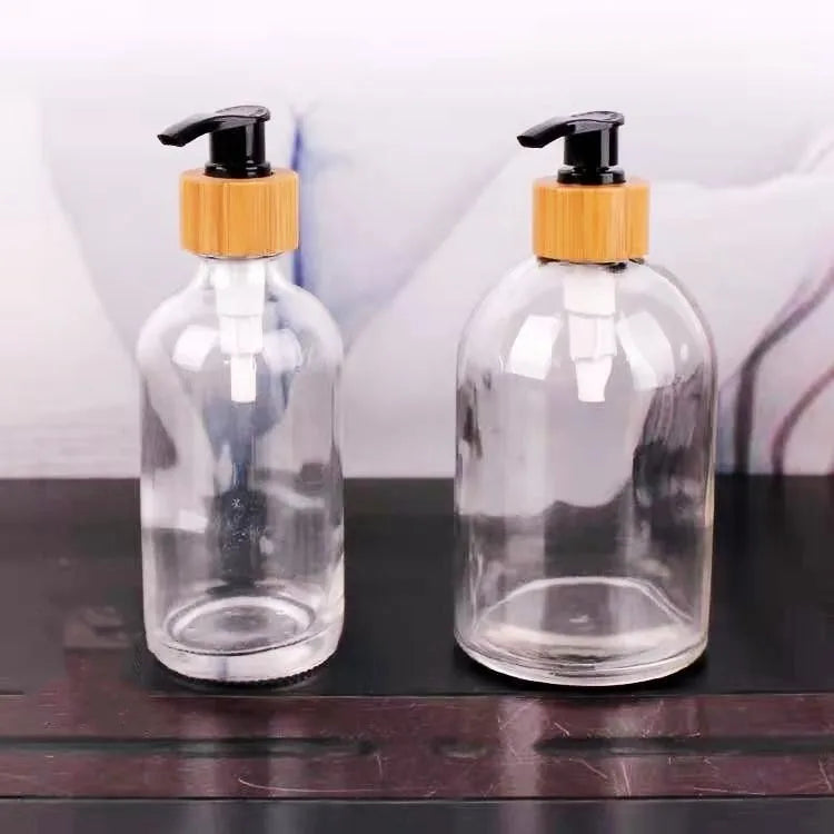 Wholesale 8oz Clear boston Round Pump Glass Bottles Shampoo Empty Lotion Bottles 250ml  with Bamboo Pump