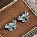2026 New White Butterfly Pearl Stud Earrings Zhuji 5-6mm AAAA Luxury Natural Freshwater Bread Pearls Women's Personalized Brass