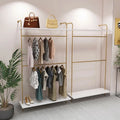 Custom Beautiful Gold Wall Mounted Garment Display Rack Shelf Retail Clothing Shop Interior Layout Design