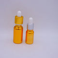 Round Empty Golden Glass Bottles with Measurement Pipette