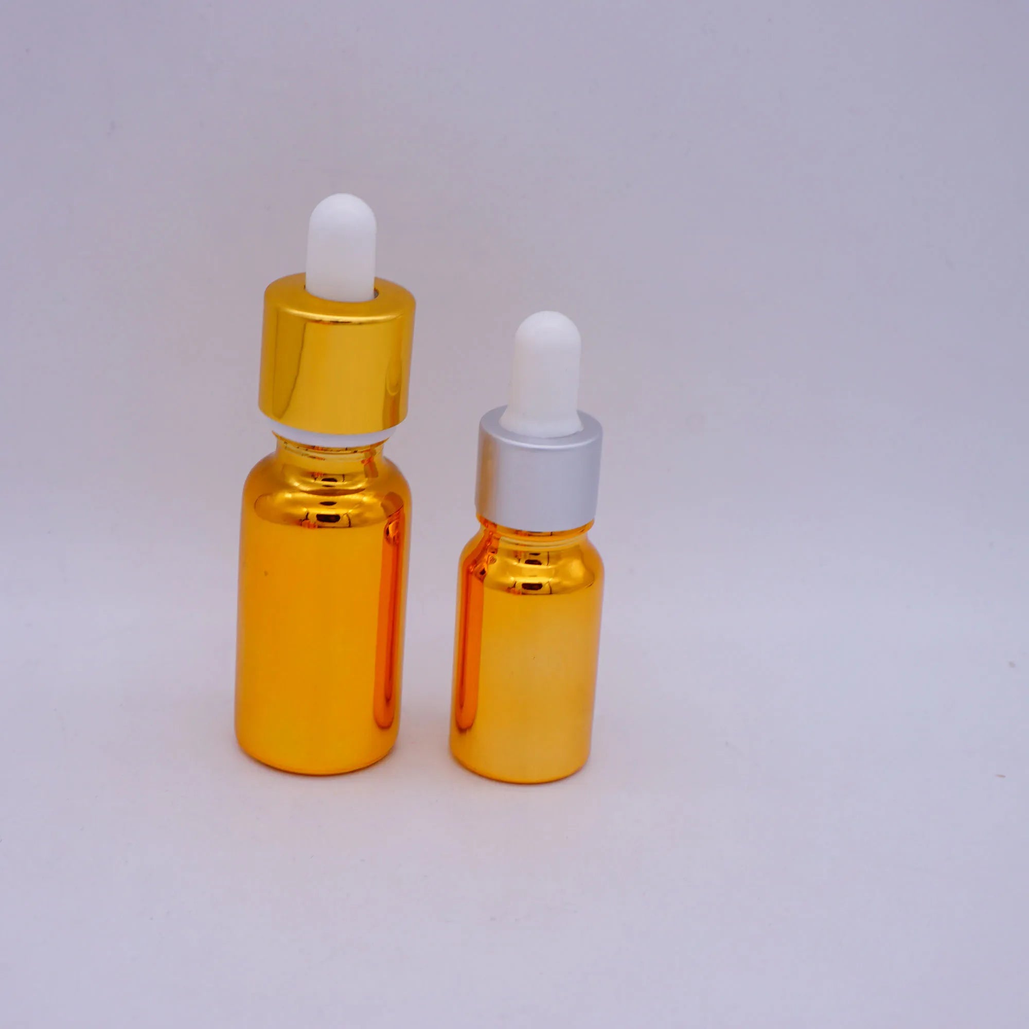 Round Empty Golden Glass Bottles with Measurement Pipette