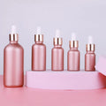 Cheap Cosmetic Face Skincare Serum Essential Oil Packaging Empty Rose Gold Color 1oz Frosted Glass Dropper Bottle