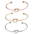 Women's Stainless Steel Heart-Shaped Love Knot Cuff Bracelet Fashionable Hollow Heart Knotted Bracelet