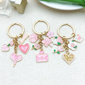 2025 Wholesale Valentine's Day Enamel Pink Dripping Oil Metal LOVE Love Rose Keychain Bag Pendant
