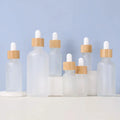 5ml 10ml 15ml 20ml 50ml 100ml 30ml 1oz Essential Clear Cuticle Frosted Glass Dropper Bottle Bamboo Lid for Face Cream Hair Oil