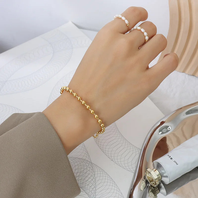 European and American Stainless Steel 18K Gold Fashion Light Luxury Simple Geometric Round Bead Heart Pendant Bracelet Women