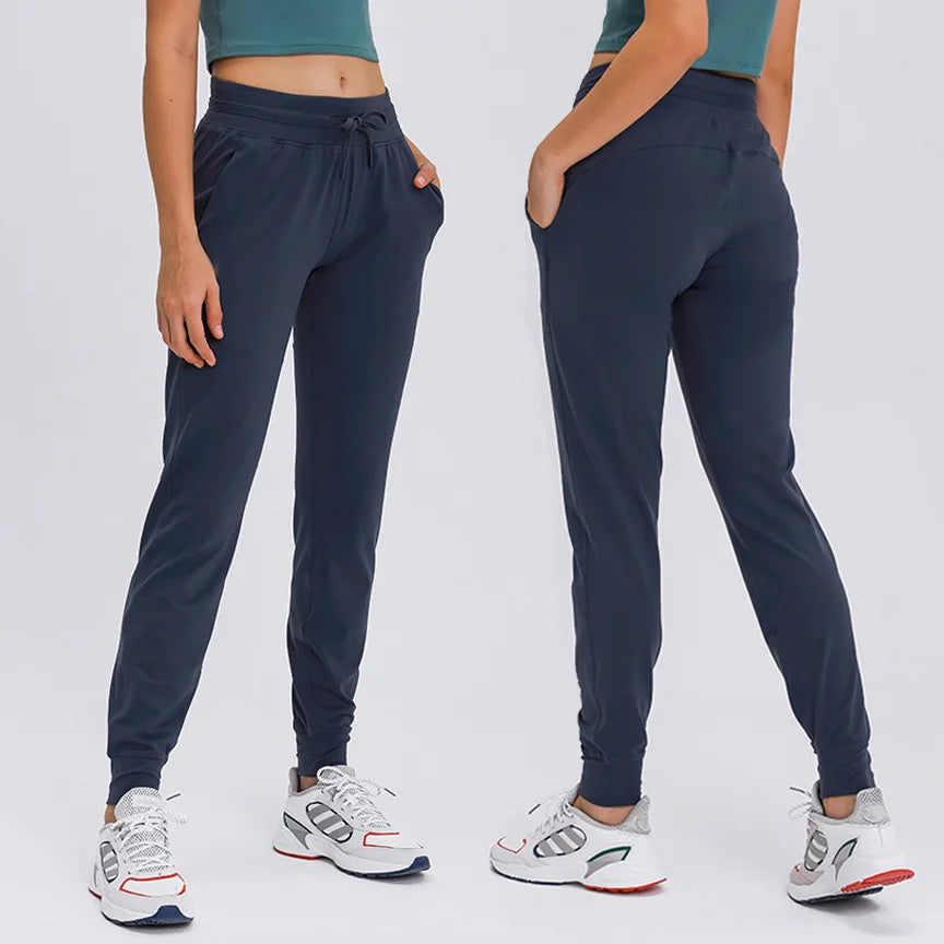 2025 New Arrival OEM Quick-Drying Girls Jogger Pants Comfortable Mid Waist Yoga Pants with Pockets for Gym Sports Leggings
