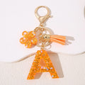 Hot Selling Cute Fashion A-Z26 Letters Resin & Metal Sequins Flowers Keychain with Butterfly Tassel Reusable Gift for Bags