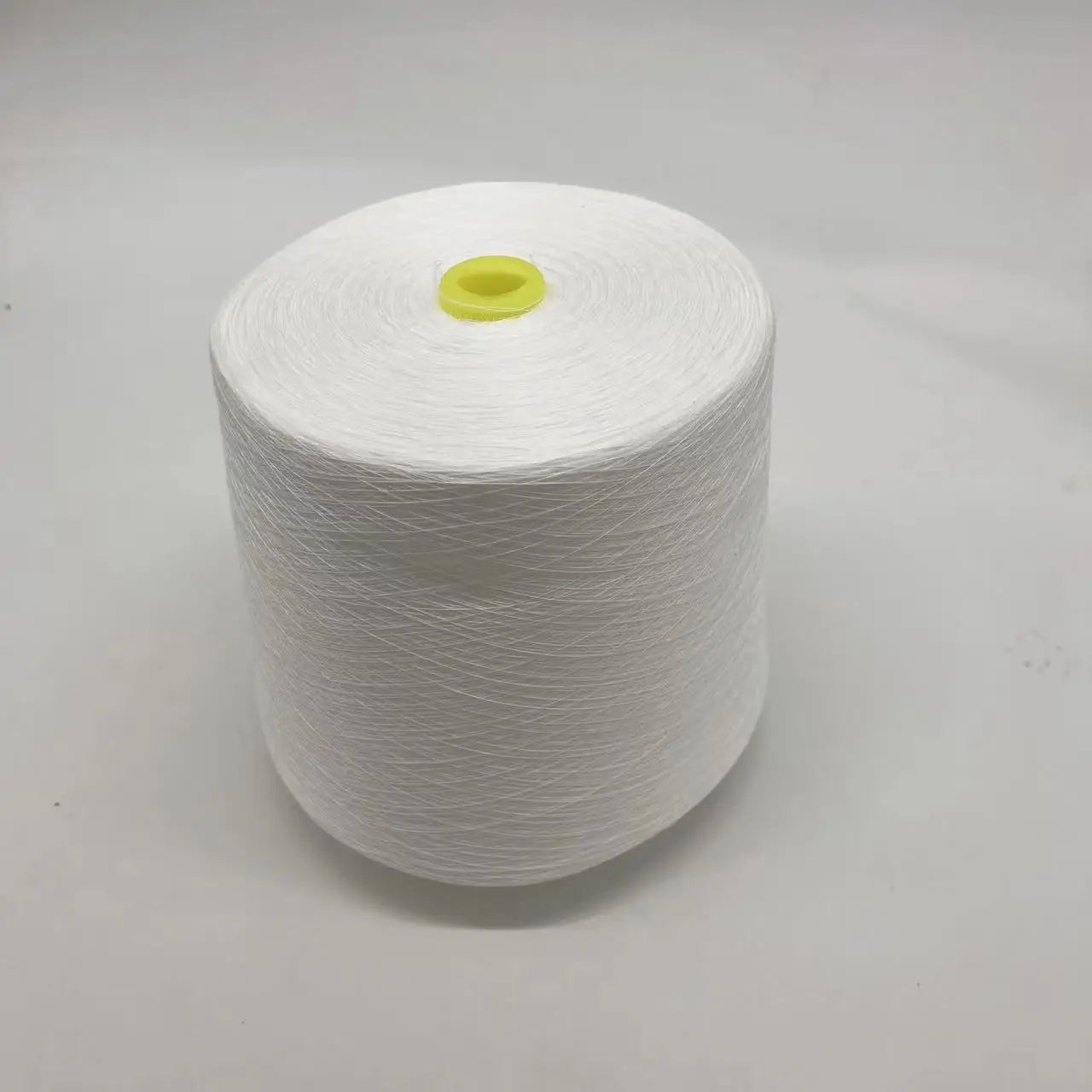 100% Polyester Staple Fiber 60S High Tenacity Dyed Bobbin Thread White Color Embroidery Sewing 602 85000m Per Cone