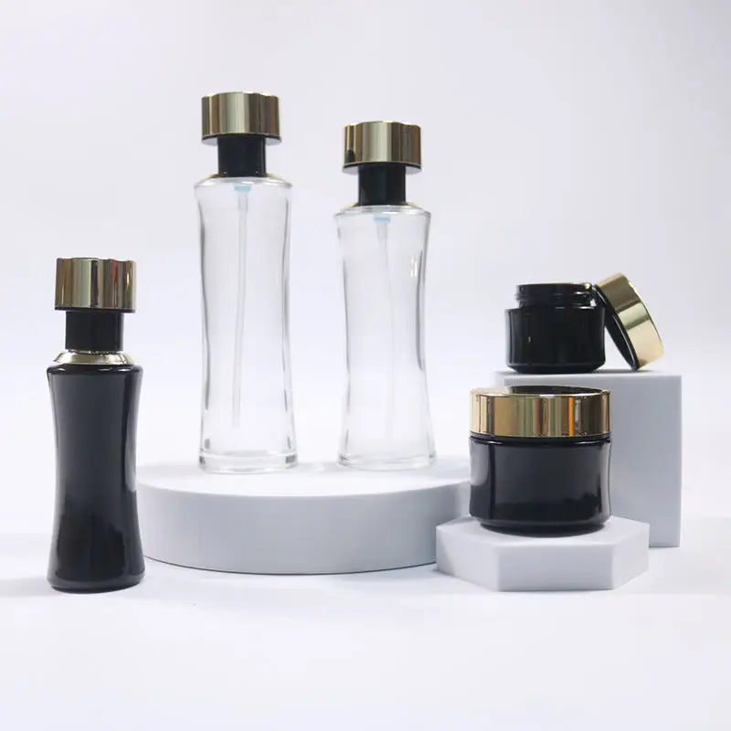 New Design Custom Luxury Empty  Gold Cap Glass Bottle Round Glass Bottles Cosmetic Cream Jar and Lotion Serum Pump Bottle Set