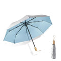 Popular Solid Wooden Handle Uv Coating Fabric Pongee Polyester Special Pocket Size 3 Folding Uv Umbrella
