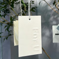 Wholesale Hard Cardboard Debossed/embossed logo Paper Clothing Labels Swing Tags Custom Logo Shape and Color hang Tags
