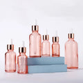 Wholesale Essential Oil Serum Glass Bottle 30ml 50ml 100ml Custom Pink Rose Gold Nail Polish Oil Dropper Bottle