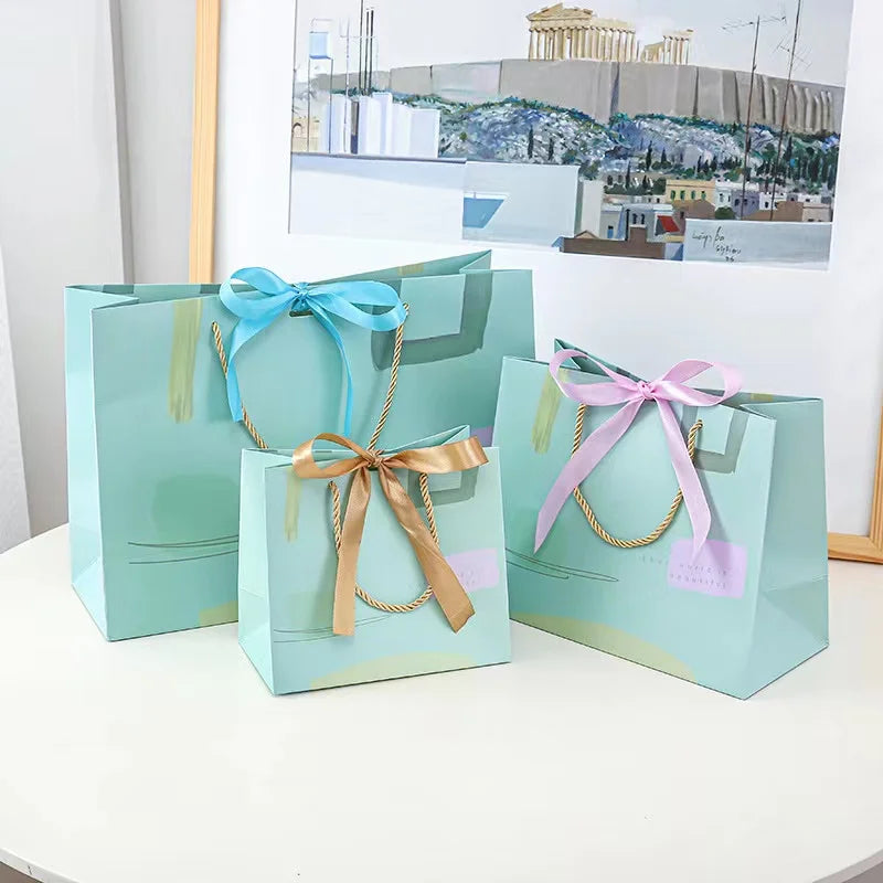 Wholesale Luxury Clothing Jewelry Cosmetic Boutique Gift Shopping Paper Packaging Bags With Ribbon Handle