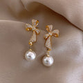 New Style Silver Needle Alloy Bow Pearl Drop Earrings Pearl Dangle Earrings Personality Wholesale Earrings