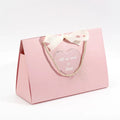 2024 Luxury Ribbon Closure Collapsible Ivory Board Shopping Bag New Design Pink Wedding Gift Bags for Guest Favor for Clothing