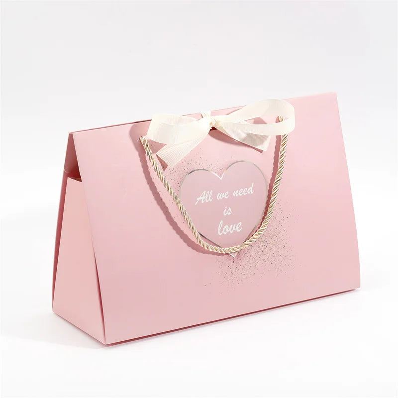 2024 Luxury Ribbon Closure Collapsible Ivory Board Shopping Bag New Design Pink Wedding Gift Bags for Guest Favor for Clothing