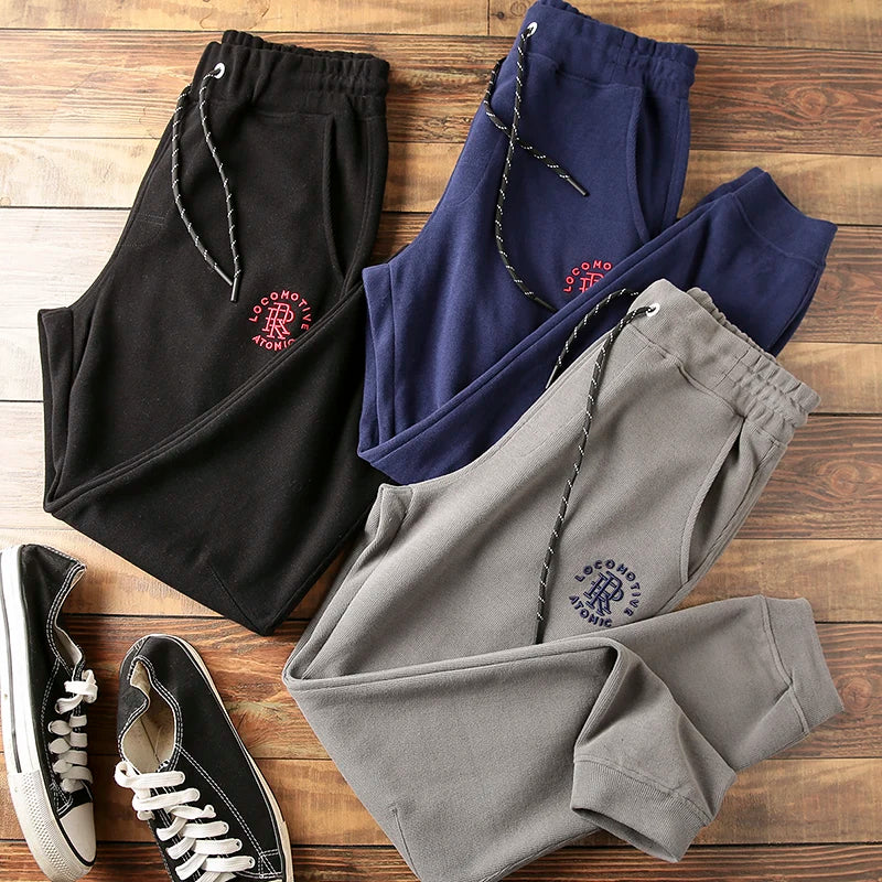2026 New Men's Cotton Sports Leg-tied Casual Pants Solid Color Three-dimensional Letter Embroidery Men's Knitted Pants.