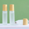 5ml 10ml Hot Sale Frosted Cylinder Shape Glass Roll on Bottle for Essential Oils Plastic Wood Grain Lid Screw Cap for Perfume
