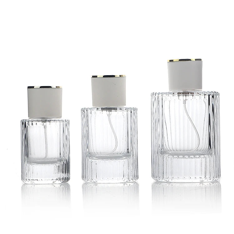 30ml 50ml 100ml Thick Glass Vertical Strip Embossed Perfume Bottle Elegant Cylindrical Perfume Spray Bottle With Crimp Pump