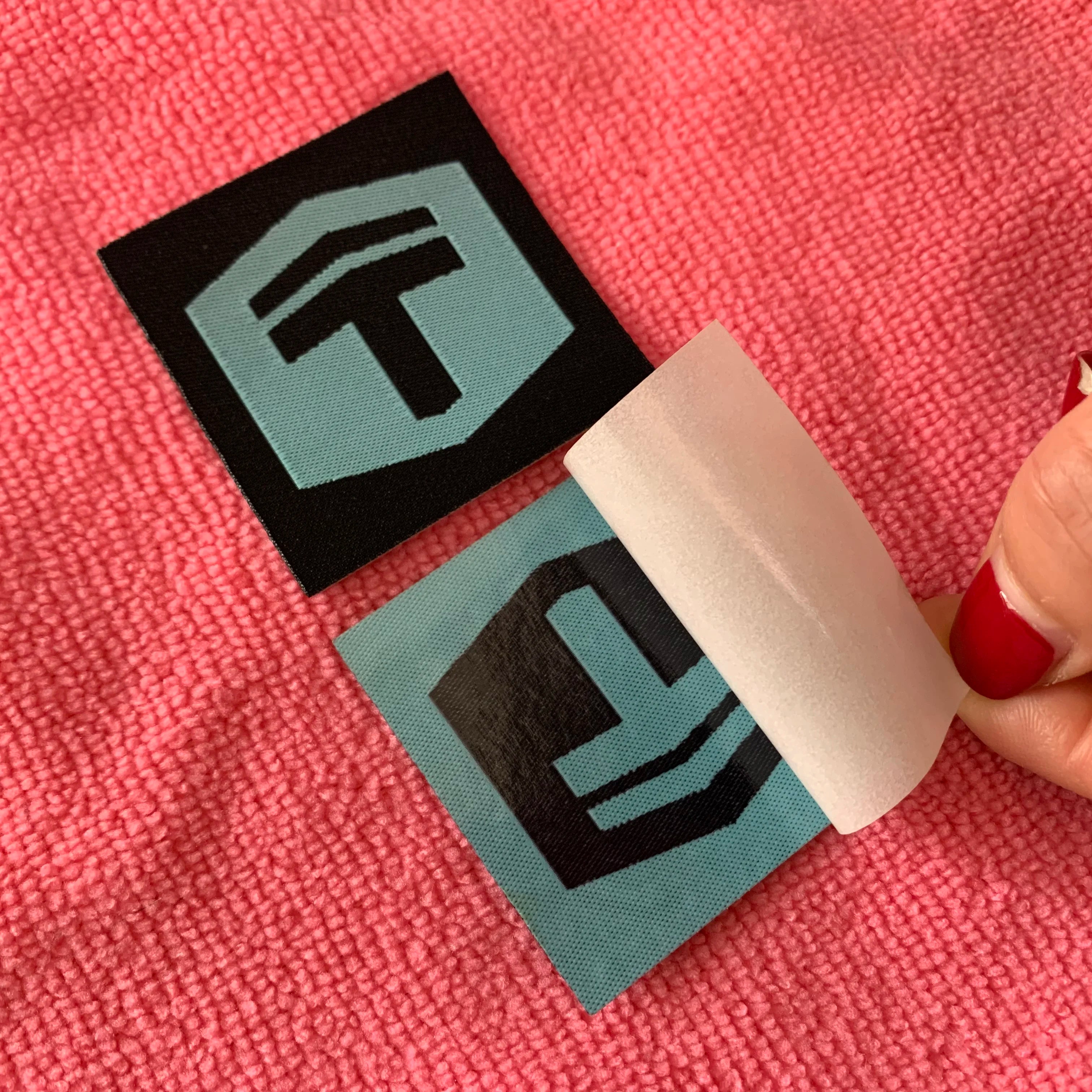 Wholesale Trademark logo Iron on Patchheat Pressed Woven Label With Glue Backing