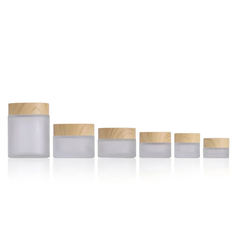 Custom Label Round Glass Jar 50g Cosmetic Packaging with Wooden Color Lid Frosted Glass Cosmetic Cream Jar