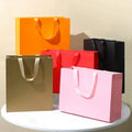 MU Pink Cardboard Paper Bag Custom logo Art Paper Bag Good Quality Low Price Shopping Gift Packing Bag