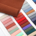 Ready Stock Wholesale Soft Hand Feel 105GSM Lousiness 5% Nylon 95% Polyester Woven Cupro Suede Fabric for Garment Lining