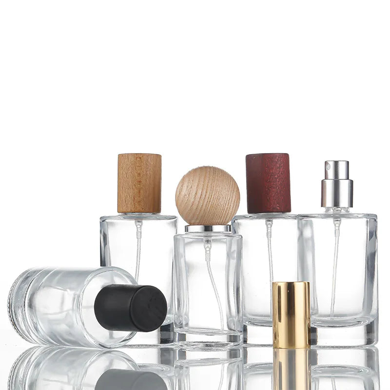 Hot Selling Thick Bottom Cylindrical Clear Color 50ml Perfume Bottles 30ml Refillable Perfume Bottle with Wood Lid