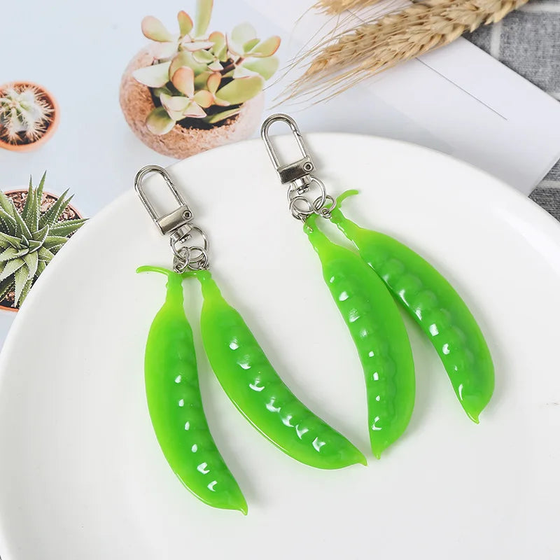 Factory Price Snow Peas Keychain OEM PVC Figure Toys Plastic Miniature Scale Model Collective Figure Small Toys