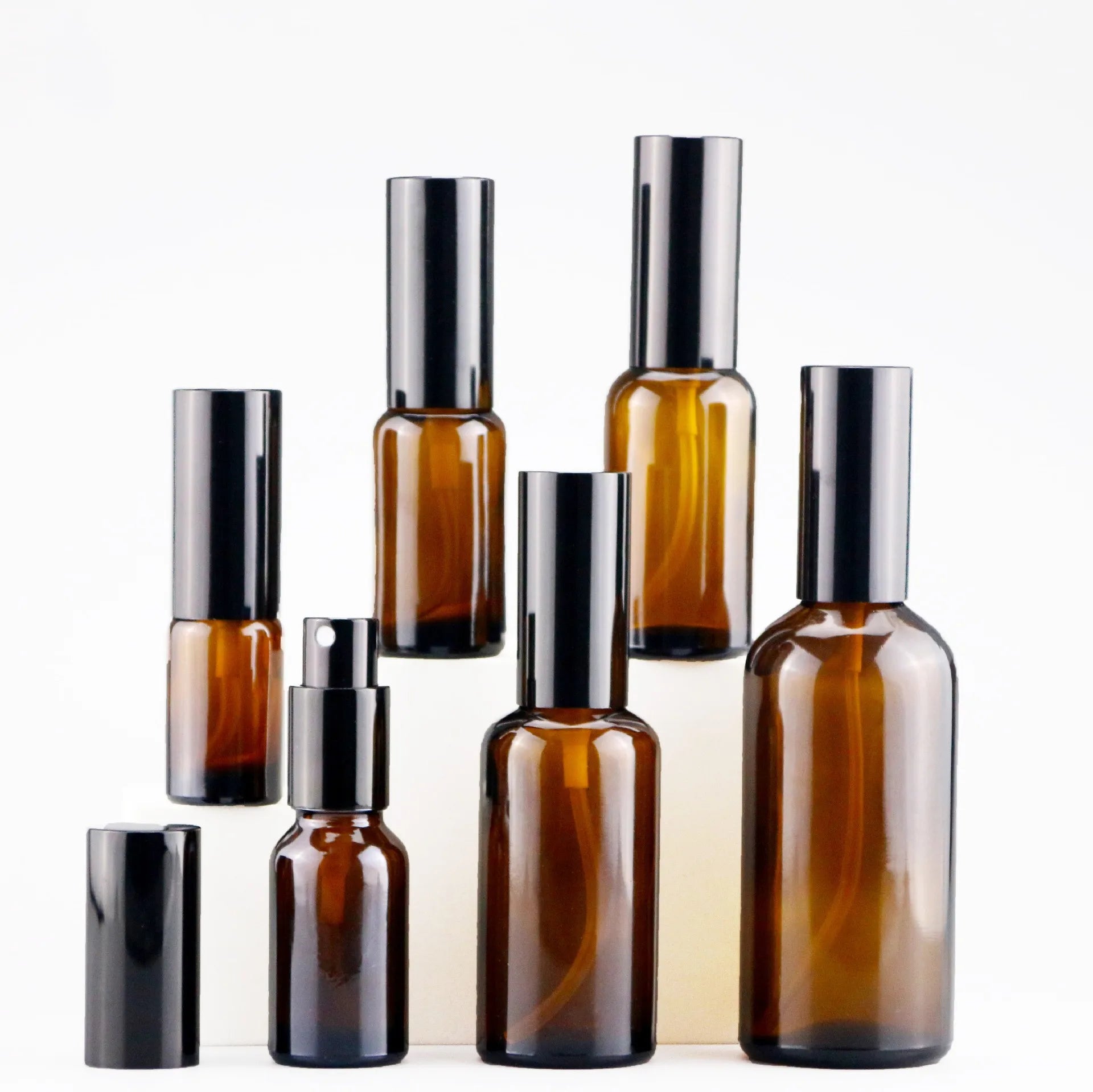 Factory Price Cosmetic Perfume Bottle Packaging Empty Round 30ml 50ml 100ml Amber Glass Face Serum Body Lotion Spray Pump Bottle
