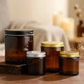Hot-selling Empty 100ml 150ml 250ml Round Amber Glass Candle Jars with Black Silver Golden Aluminum Lids