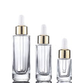 Custom logo 15ml 30ml 50ml clear square Dropper Bottle with Gold and Silver Personal Care Production Cosmetic Package Container