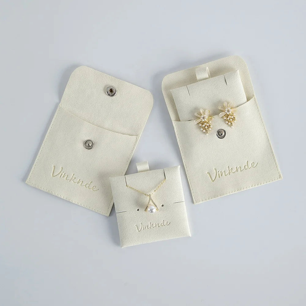 Custom Logo Beige Ivory Luxury Beautiful Deboss Emboss Microfiber Earring Rings Bags Snap Pouch for Girl Women with Insert
