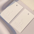Luxury Custom hang Tags with logo Design Printing Fashion Garment Paper hang Tag Embossed Clothing Swing Tag with String
