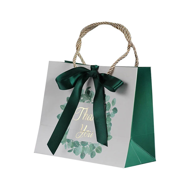 Luxury Custom White Cardboard Kraft Paper Gift Bag with Pink Gold Bow for Toys Clothing Shoes Features Lamination Printing