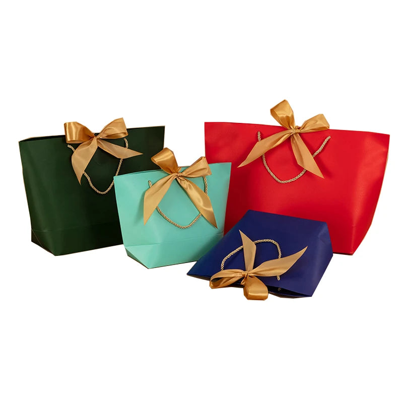 Wholesale Uniquecolour Printing Commercial Luxury Shopping Dupont Paper Tote Bag Custom Logo Paper Gift Bags With Handles OEM