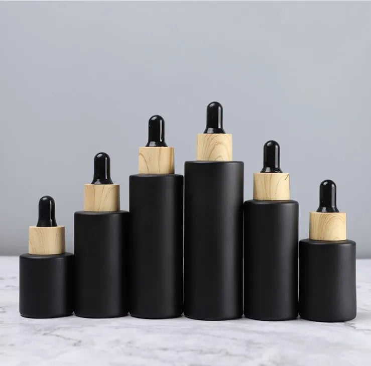 Top Grade 20ml 30ml 40ml 50ml 60ml 80ml 100ml Matte Black Glass Dropper Bottles with Bamboo Lid for Sale