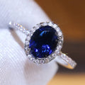 Huitan Luxury Fashion Silver Plated Oval Cut Sapphire Cubic Zirconia Engagement Party Rings for Women