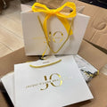 Wholesale Private Label Light Pink Luxury Recyclable Handle Paper Shopping Bag Makeup Package Cosmetic Gift Bag