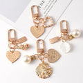 Wholesale Cute Pearl Shell Keychain Pendants Metal Creative Small Promotional Gifts Heart Pendants for Phone Bag Key