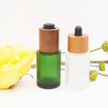 Cosmetic Container  Blue  Flat Shoulder Green Dropper Glass Bottle with Dark Wooden Push Button Dropper