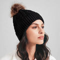 Wholesale Custom Logo Acrylic Knit Bobble for Women Cable Rib Faux Fur Pom Pom Beanie Hat with Custom Logo Patch Business Travel